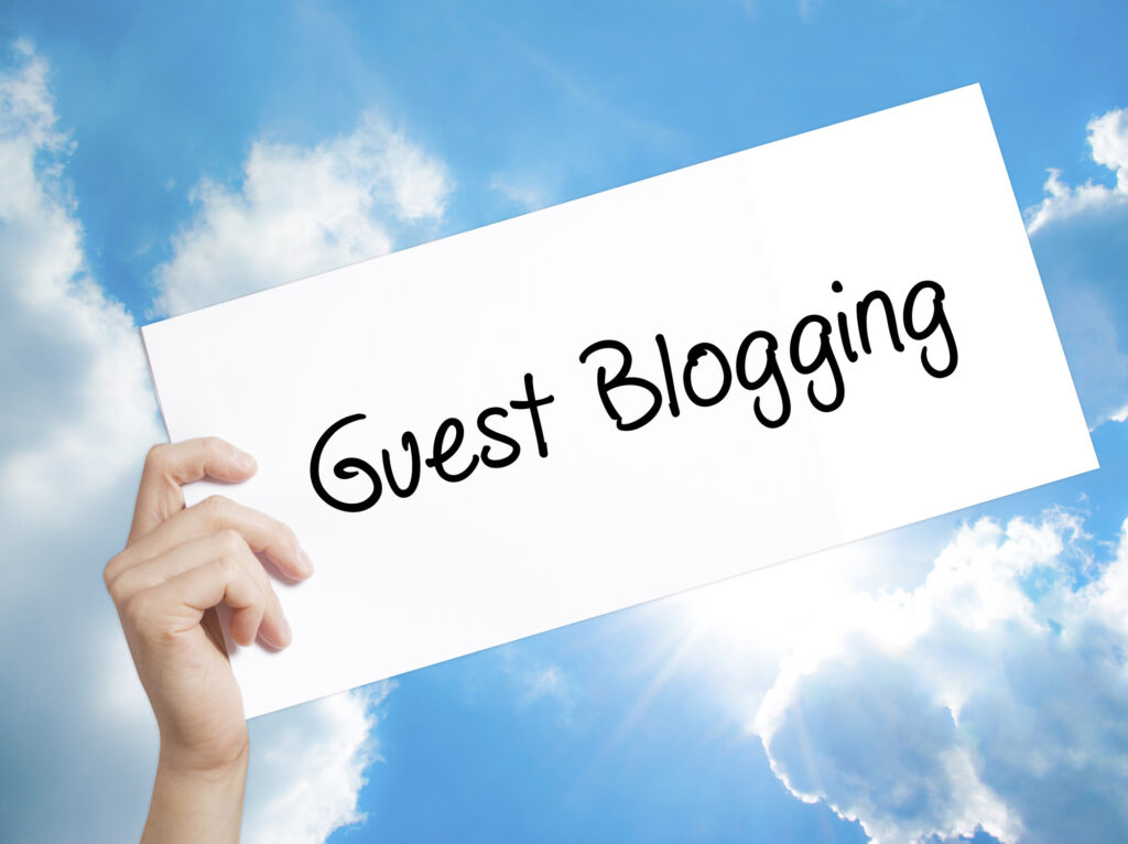 Image of Guest Blogging text written on paper